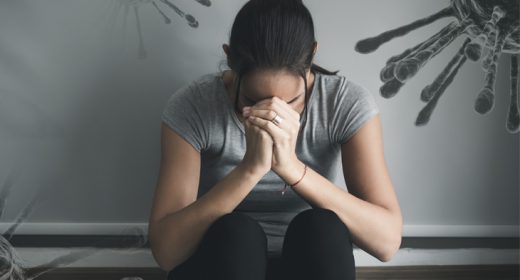Woman with a mental health illness sitting sad in the room with headache and stress, home quarantine fear of the Coronavirus or COVID-19 outbreak. Double exposure 3D virus background copy space.